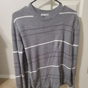 Women's gray and white striped sweater.